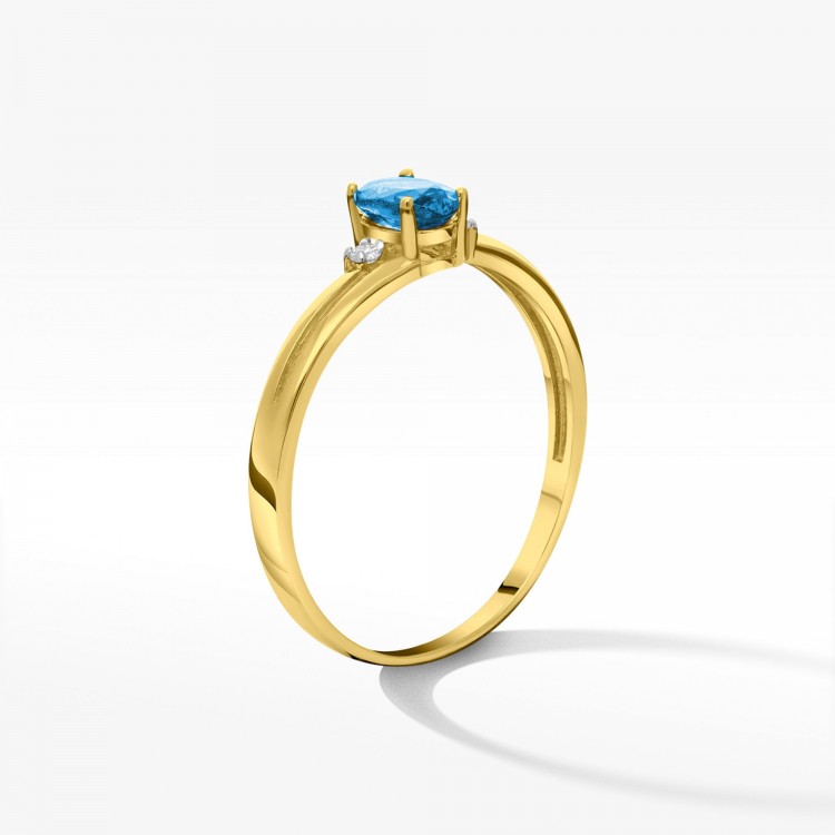Złoty pierścionek z topazem i diamentami