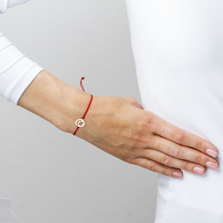 Bransoletka ze złota na sznurku psia łapa