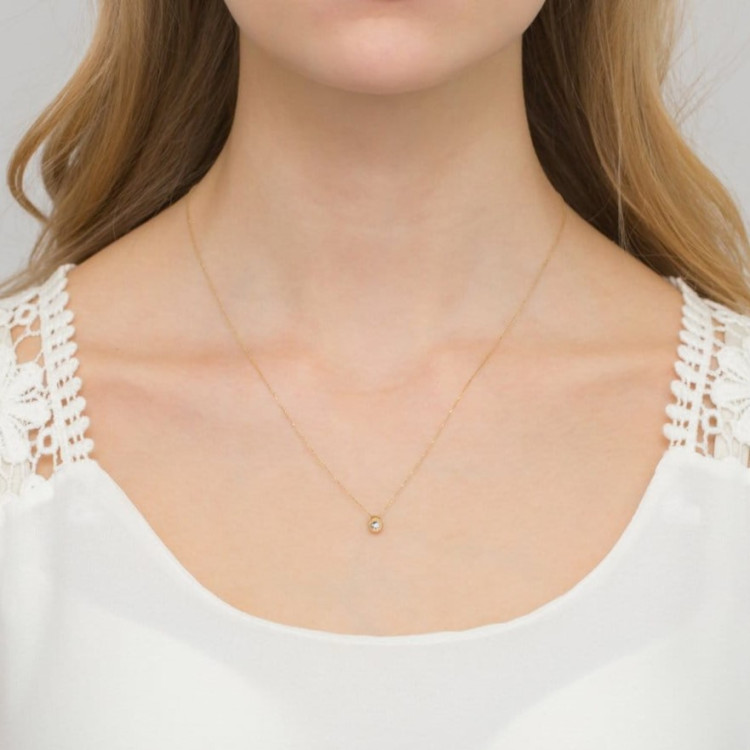 Złota celebrytka z diamentem z białego złota