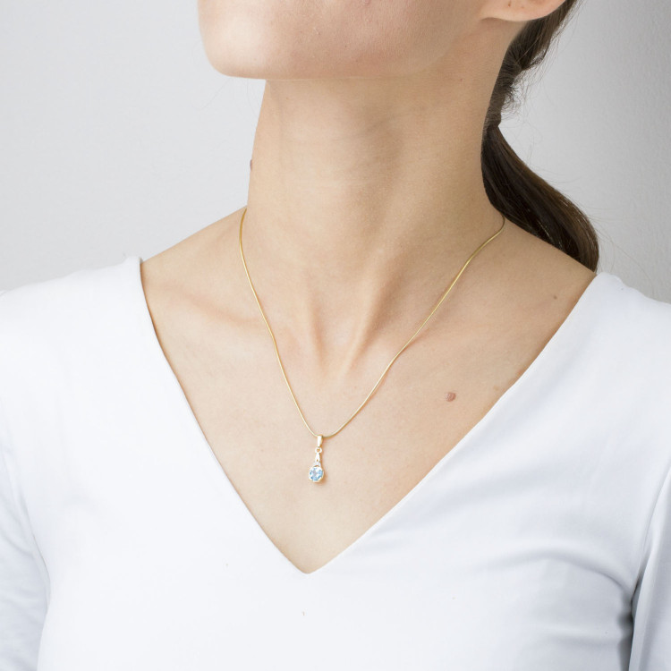 Zawieszka ze złota z topazem i diamentami