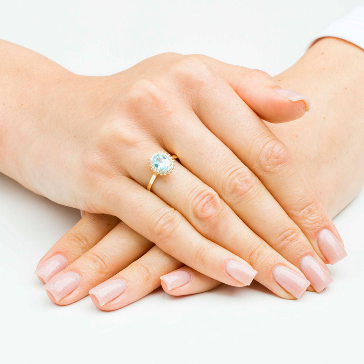 Pierścionek ze złota z niebieską i białymi cyrkoniami