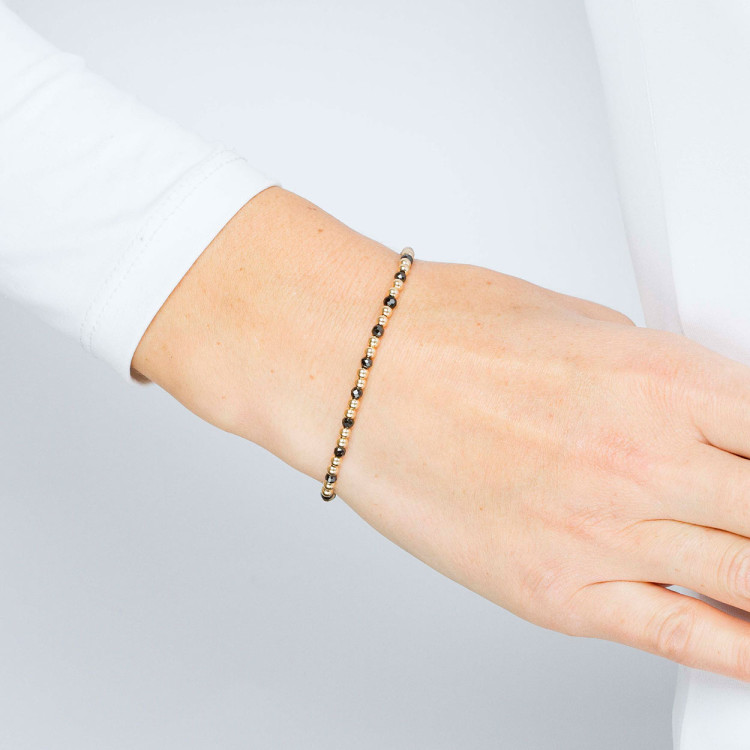 Bransoletka ze złota ze złotymi i czarnymi koralikami