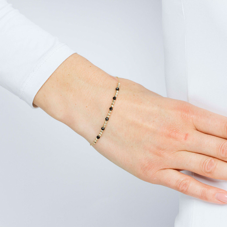 Bransoletka ze złota z czarnymi i złotymi koralikami