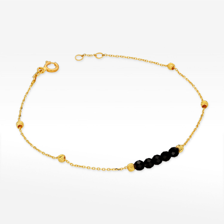 Bransoletka ze złota z czarnymi koralikami