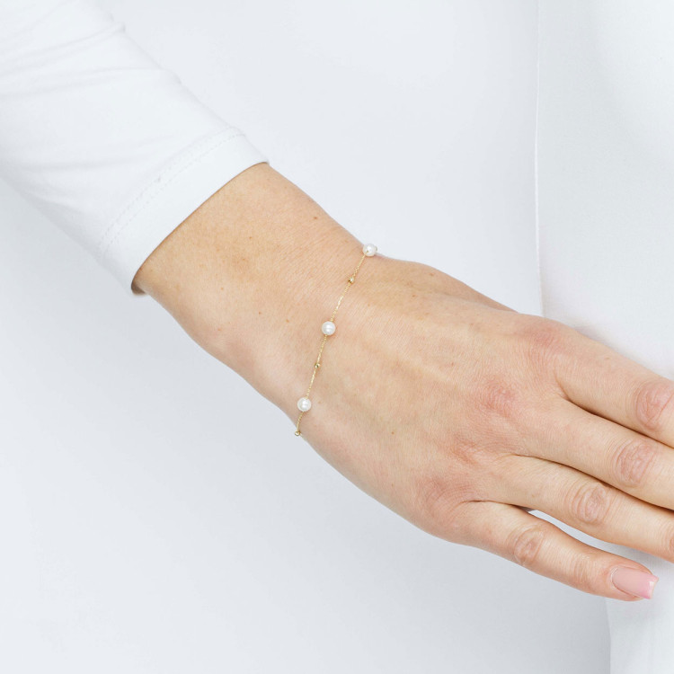 Bransoletka ze złota z białymi i złotymi cyrkoniami