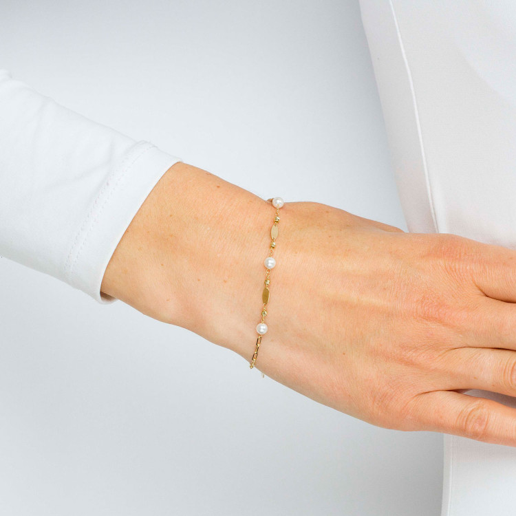 Bransoletka ze złota z białymi koralikami