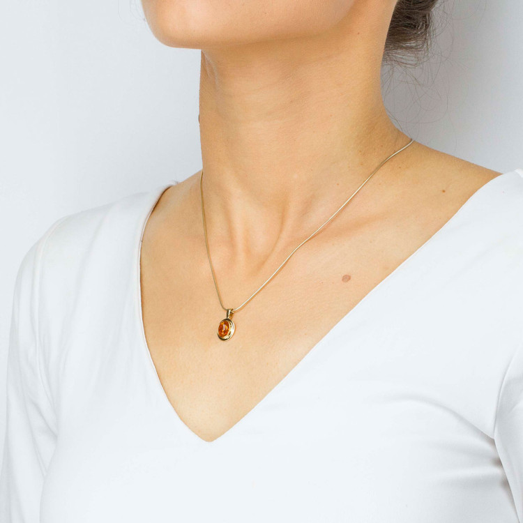 Zawieszka ze złota z bursztynem